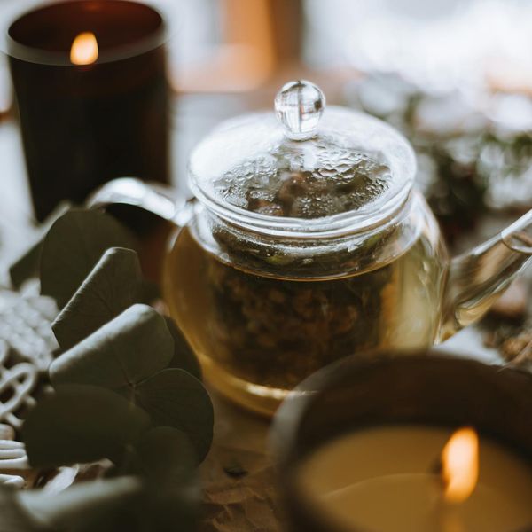 Person enjoying herbal tea ritual in a calm atmosphere